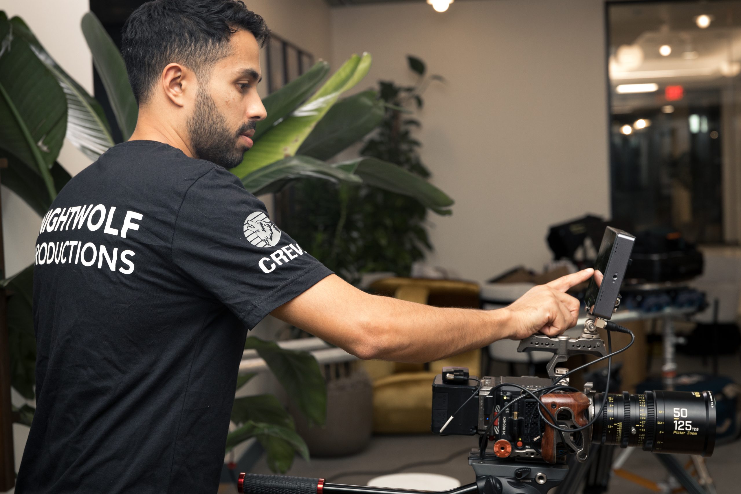 A man operating a camera